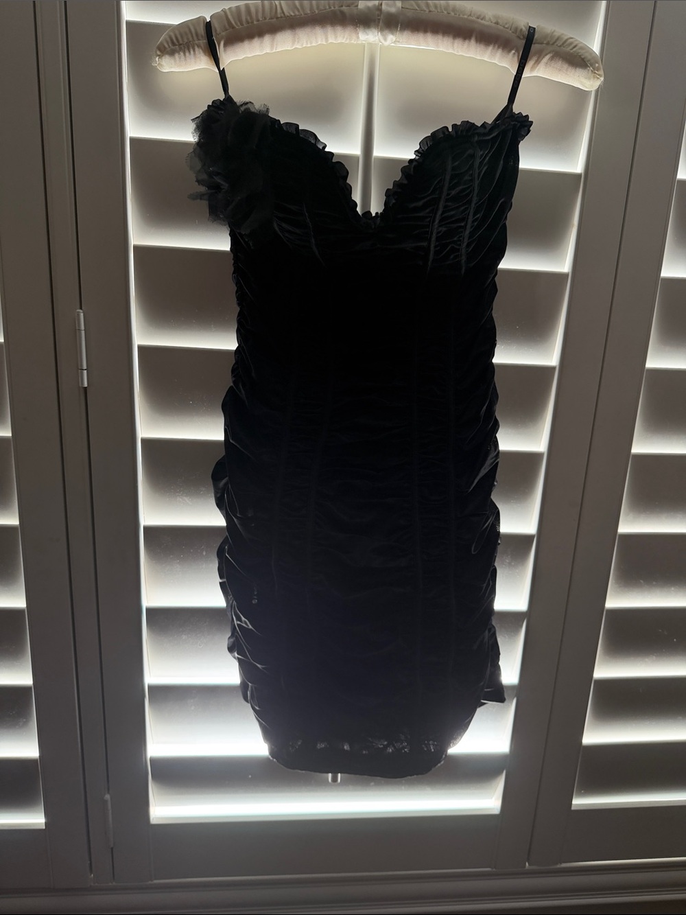 Bebe new silky Black Ruched strapless Dress Floral Accent, size M. Chest-32”.